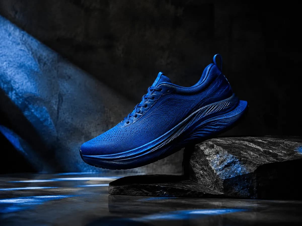 Blue running shoe staged for a cinematic product campaign